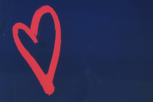 Red heart on blue background